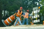 Workers moving barricades 1