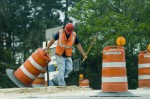 Workers moving barricades 2