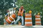 Workers moving barricades 4