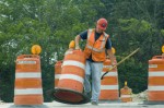 Workers moving barricades 3